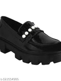 Detailed black synthetic loafers by Stylestry for women, featuring chain detailing and slip-on design, perfect for work or weekends