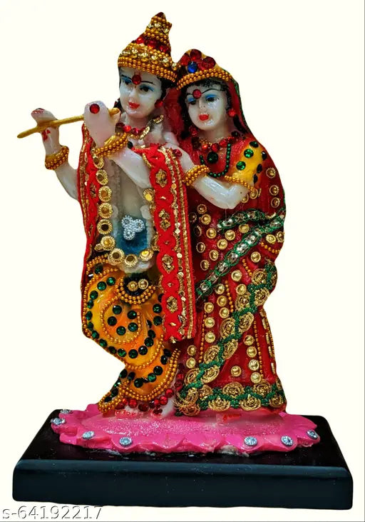 Multicolor poly resin Lord Radha Krishna Murti statue for puja home decor, intricately detailed with fancy stones on lotus platform. Indian origin." (108 characters)