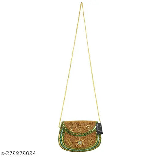 Gold handbag with gold chain strap, likely made of a reflective fabric
