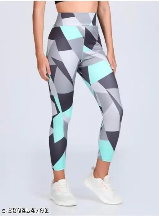 Stretchable striped sports track pants for women, colorblocked Lycra yoga gym jeggings for active workouts. Size 28-38 inch, breathable & moisture-wicking fabric. Adjustable drawstring waistband. Indian origin