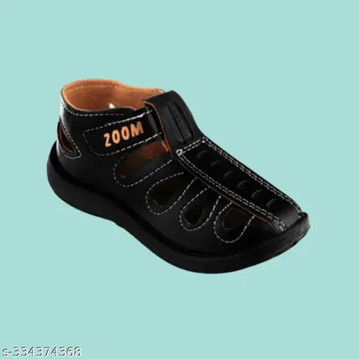 Black, pvc unisex kids sandals with 'kids' written in white on top strap
