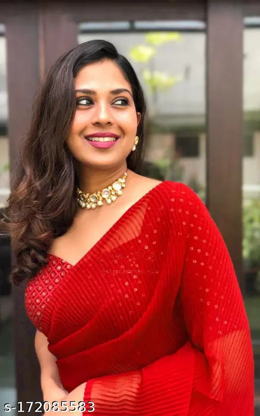Red saree with a matching blouse, traditional wear design