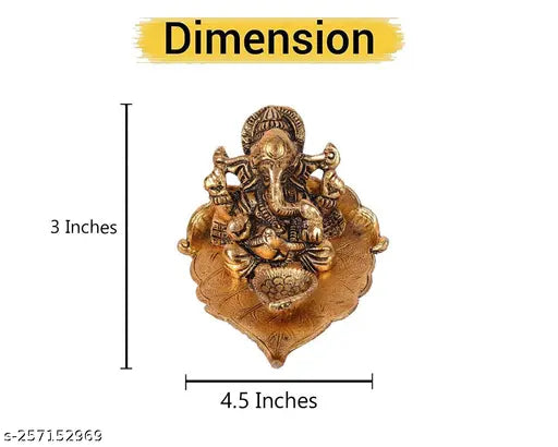Gold metal Ganesh statue on pipal leaf with diya, decorative home office gifting item
