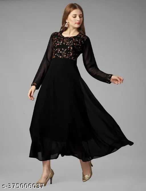 A woman in a long, elegant dress with lace details and flared hem