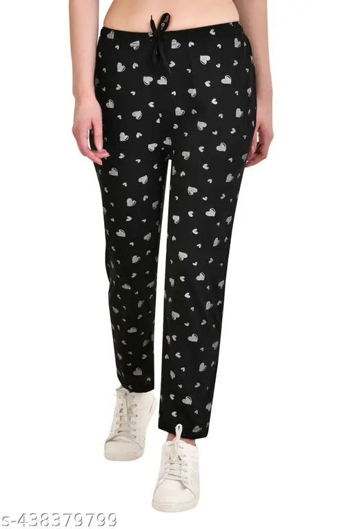 Black track pants with white cat print
