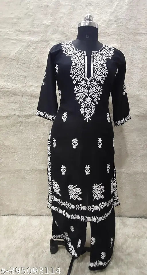 Embroidered rayon Chikankari work kurti with matching plazoo bottomwear, three-quarter sleeves on mannequin