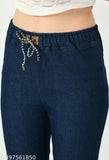 A pair of stretchable dark blue flared jogger jeans with a premium denim material, featuring an elastic waistband and ankle cuffs, in a mid-waist design