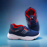 A pair of navy sneakers with white soles and red accents, designed for kids' casual wear
