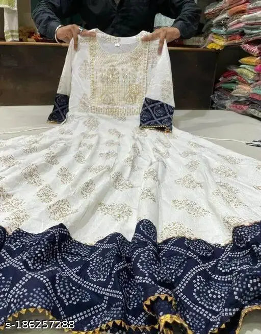 Trendy printed rayon Anarkali kurti with three-quarter sleeves, featuring vibrant Indian prints. Model wears size M (38in bust, 50in length)