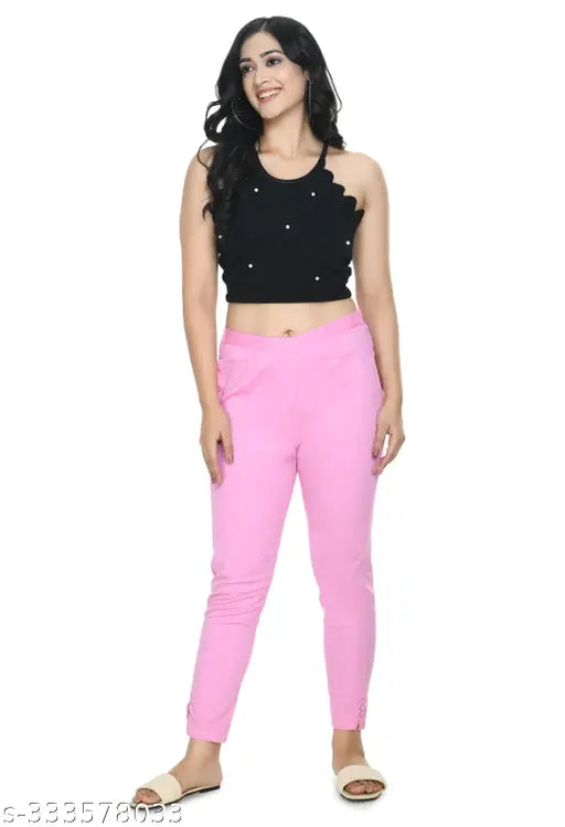 Baby pink solid cropped cigarette trousers by Preego, women's slim fit cotton blend trousers with half elasticated waistband, available in multiple sizes from 26 to 44 inches (waist and length)