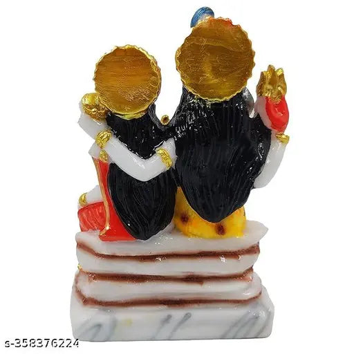 Black figurines with gold accents depicting Hindu gods