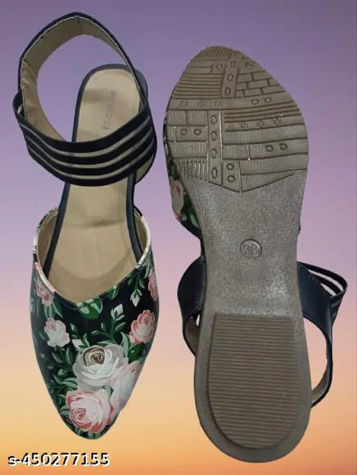 Black slip-on shoes with floral detailing