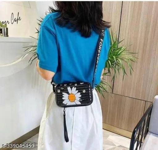 Blue shoulder bag with floral embroidery, featuring a zip closure and multiple card slots