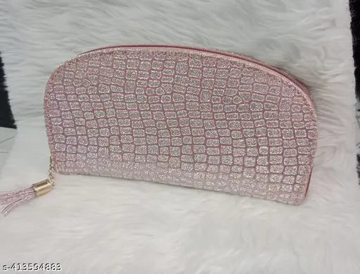 Fancy, shiny pink alligator-skin clutch purse with zipper closure