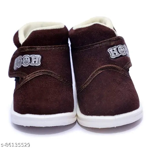 Brown velvet infant shoes with white soles