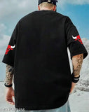 Black oversized men's graphic print cotton t-shirt, featuring bulls motif, short sleeves, and oversized fit