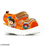 Bright orange and tan sandals featuring cartoon characters