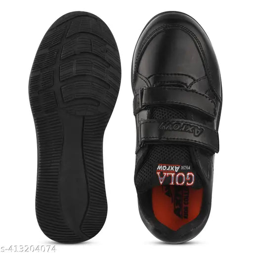 Black shoe, possibly made of leather or synthetic material, with a single strap and buckle closure, designed for boys' school uniform
