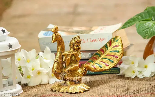 Golden metal sitting deity statue on peacock, religious puja decorative item