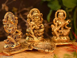 Laxmi Ganesh Sarawati metal idol on kela leaf with diya set, Indian Vastu, home, office gifting for luck and happiness. Size: L-B-H-20x11x10 cm