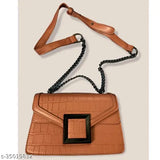 Brown leather crossbody bag with zip closure and silver hardware