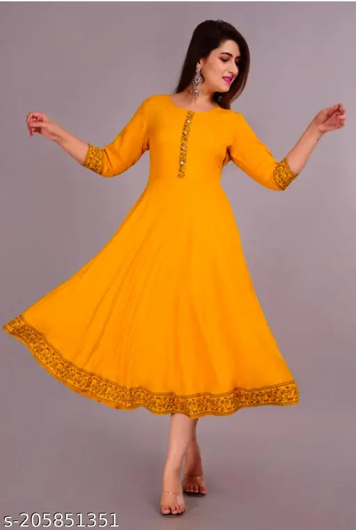 Yellow kameez with traditional design, churi details on hem