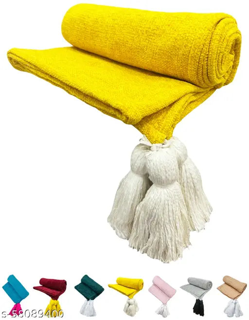 Soft, yellow throw blanket with fringe ends
