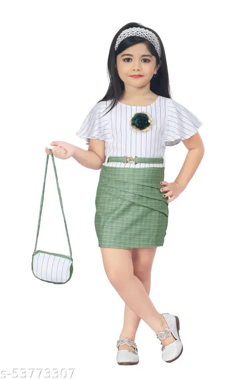 Girl wearing sleeveless, blue skirt with white trim and holding a mint green clutch purse