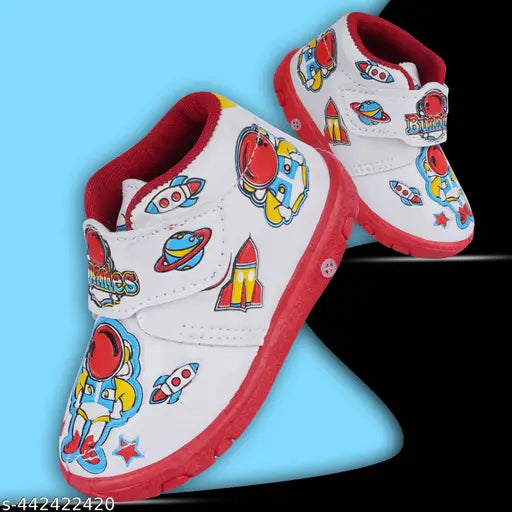 Red and white children's shoes with cartoon characters on top