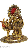 Metal figurine of Radha Krishna with cow, traditional Indian Krishna idol on a green base