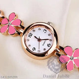 Pink flower accent, rose gold metal case, black leather band analog watch for girls with white face and number markers