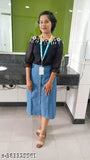Light blue linen skirt with dark top