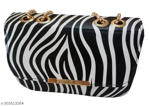 Black and white zebra print fabric, quilted design, flap closure