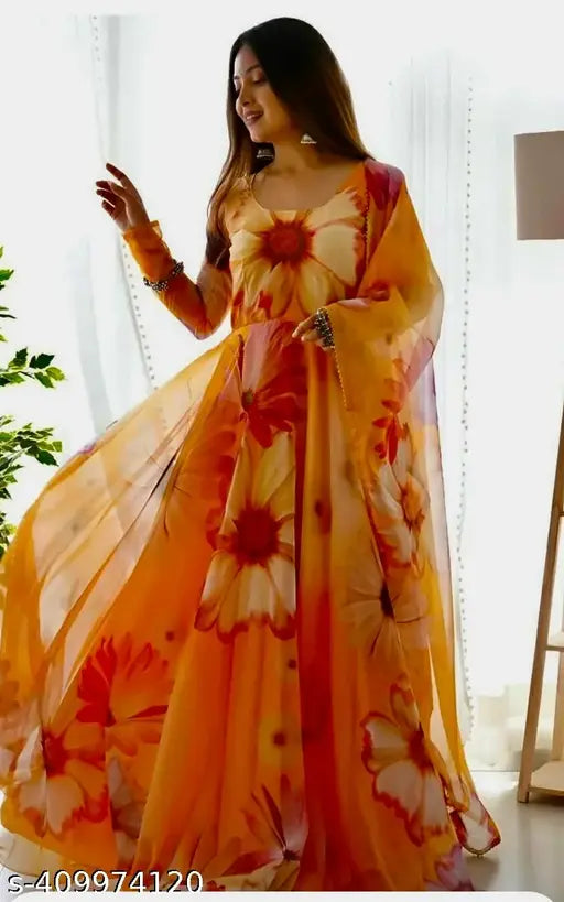 Yellow Georgette collared neck gown for women's western wear, long sleeves, printed net, button and bow detail. High quality, breathable fabric suitable for parties, engagements, weddings. By Shree Ganesh Shop from Meesho. Made in India