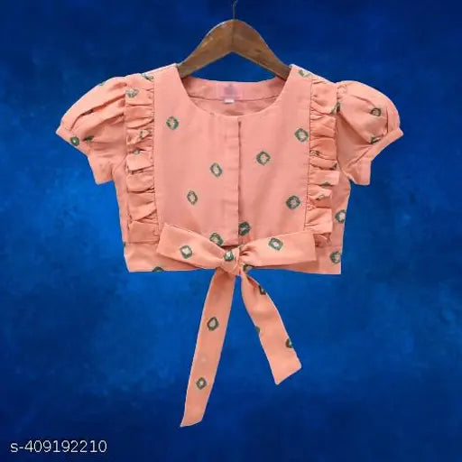 Colorblocked rayon lehenga choli set, short sleeves printed design on display stand, multiple sizes available for kids aged 3-12 years, made in India