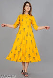 Yellow rayon women's printed Aline kurti with three-quarter sleeves, great for casualwear. Made in India