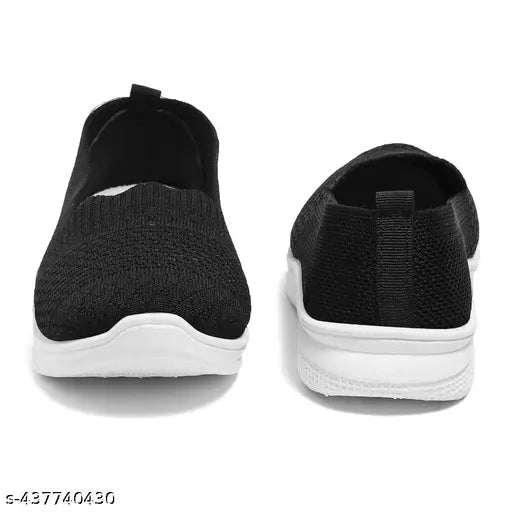 The image features a pair of women's bellies. These bellies are black and appear to have white accents, possibly a decorative detail or trim. They are presented in a product style photo, showcasing the design from two different angles
