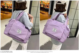 Purple Viyaro folding travel duffle bag for women, shoulder strap and handles, shopping bag with label, capacity unknown