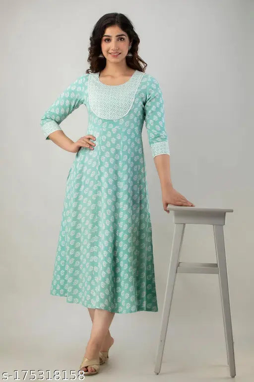 A woman wearing a long, flared kurta in navy blue