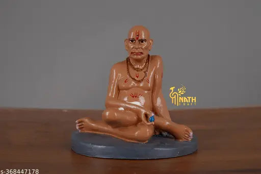 Brown marble Swami Samarth idol in sitting position, traditional religious decor for car dashboards and home offices