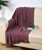 Maroon cotton throw, suitable for sofa or bed, displayed on sofa