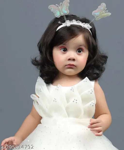 Embellished net sleeveless Barbie white frock, single piece for toddler partywear. Made in India