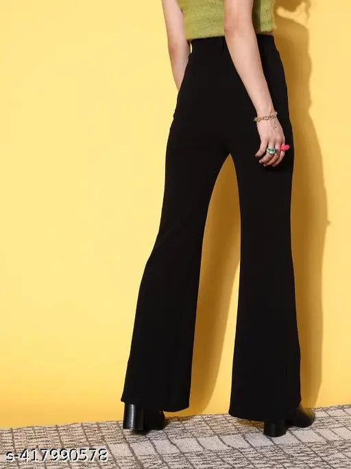 Black high-waisted jumpsuit with wide-leg trousers and deep v-neck top