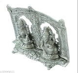 Silver-plated oxide metal Ganesh and Laxmi idol statues with frame decoration, pooja showpiece, measuring 8x6 inches (21x5x14 cm). Perfect for home or office temple, bringing growth, wealth, prosperity, knowledge, and austerity. Ideal gift for special occasions or religious events. Origin: India