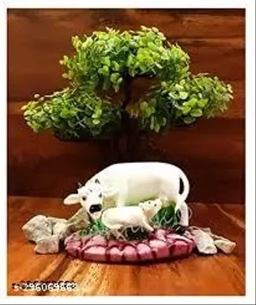 Poly resin Kamdhenu Cow and Calf statues for temple decor, height 10cm, length 12cm, breadth 7cm from Haridwar