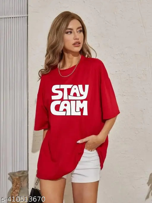 Red oversized t-shirt with the Stay Calm graphic, worn by a woman in a sleeveless top