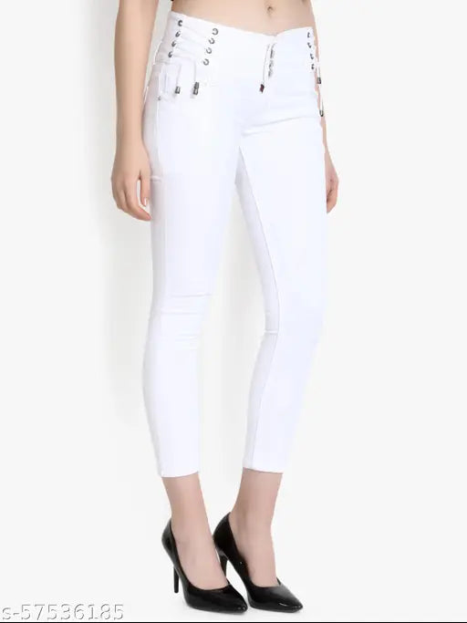 White high-waisted skinny jeans with black studded belt loops
