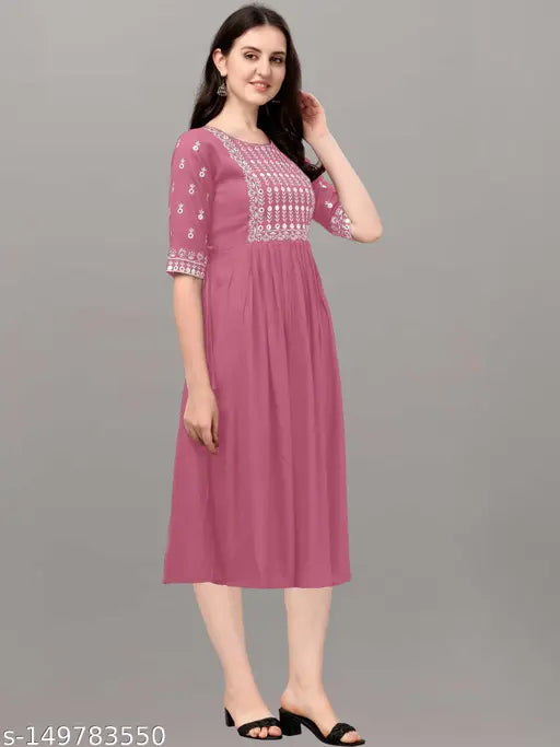 Rayon embroidered kurta, three-quarter sleeves, party & casual style in classic colors. Rayon, relaxed fit, suitable for work, daily wear, festive, or party. Machine washable, made in India