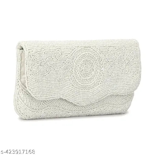 The image depicts a white handbag with an intricate embroidered design, featuring what appears to be a floral pattern. It has a chain strap and is shown from the front with the closure visible