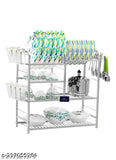 Stainless steel wall-mounted kitchen utensils rack with four shelves and a plate holder on top, containing various spoons, glasses, and bowls